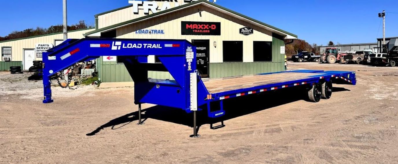 A Load Trail Blue Trailer in a Trailer Dealer Yard